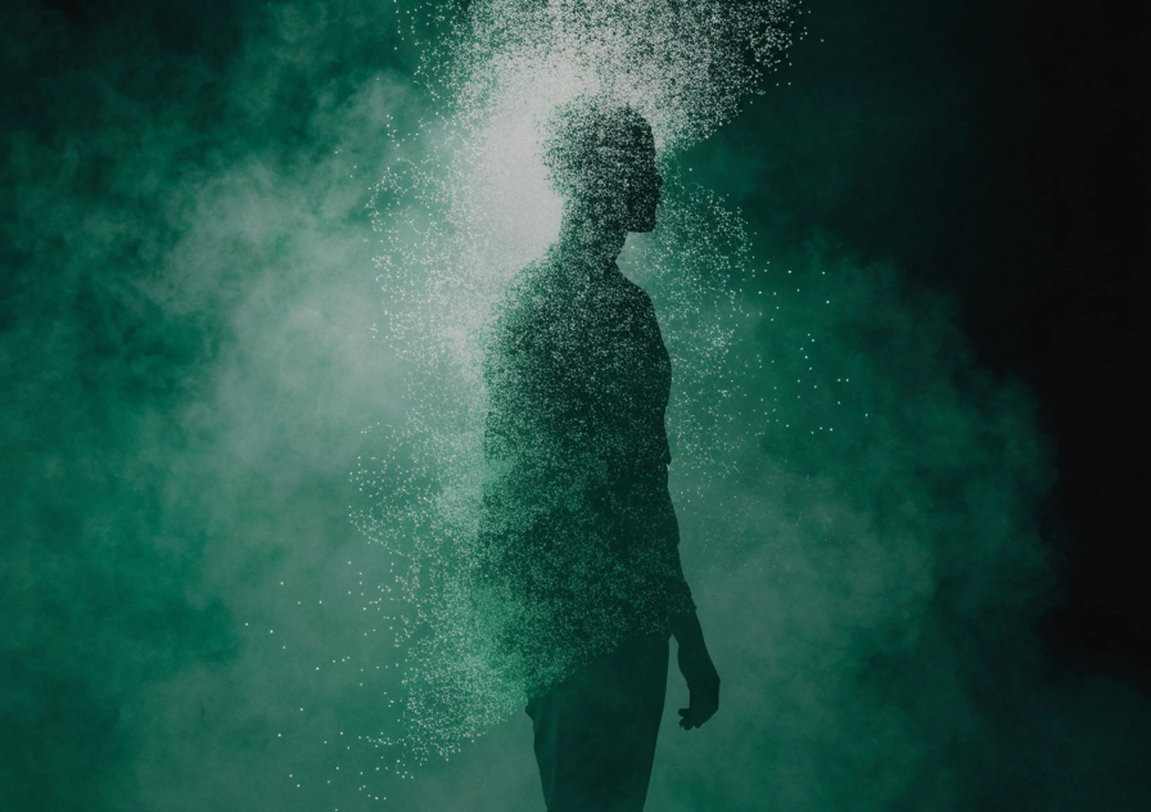 A human silhouette dissolving upward into streaming points of data.